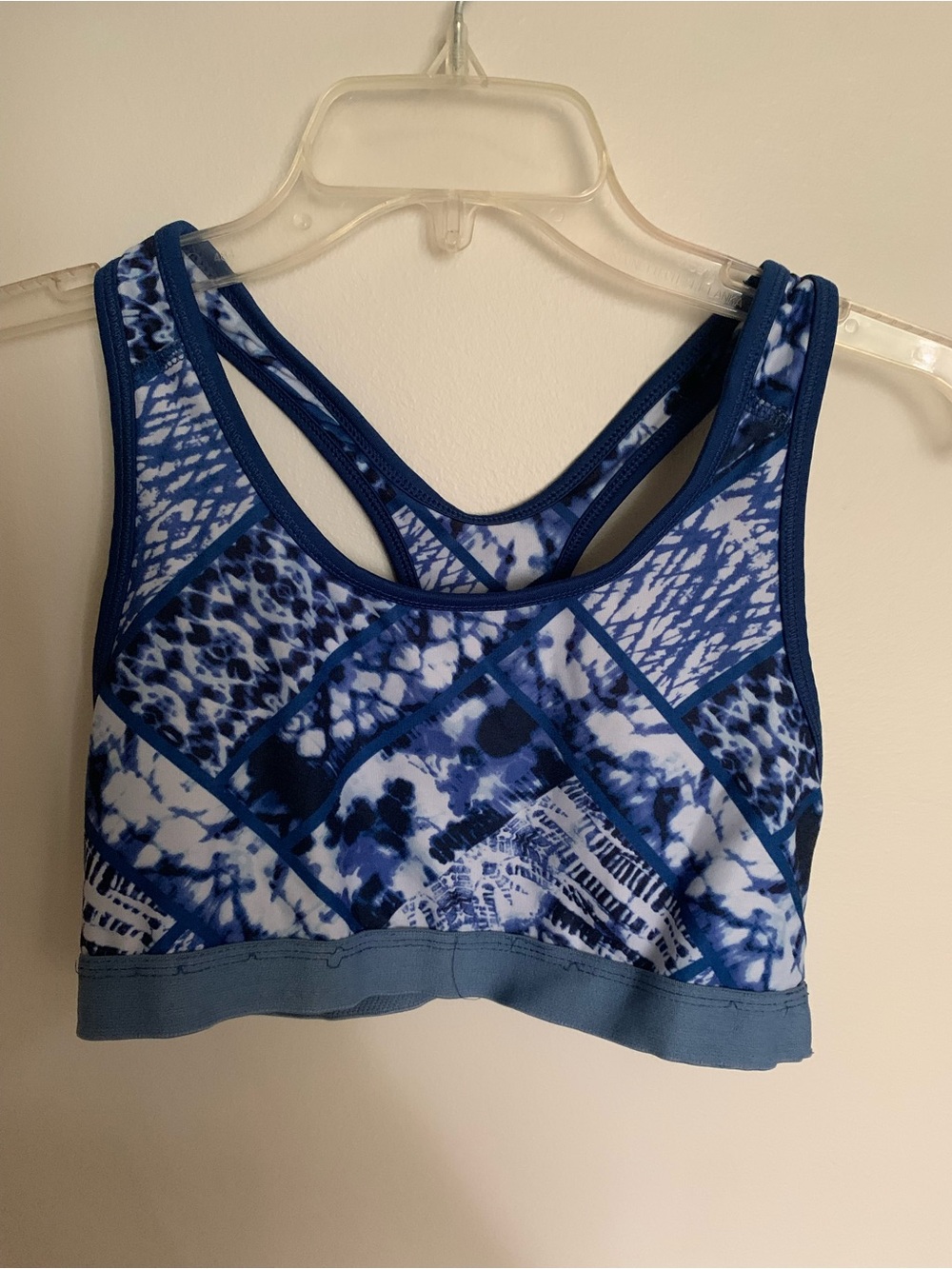 Woman’s Danskin Now Blue and White Patchwork Racerback Sports Bra. Size M